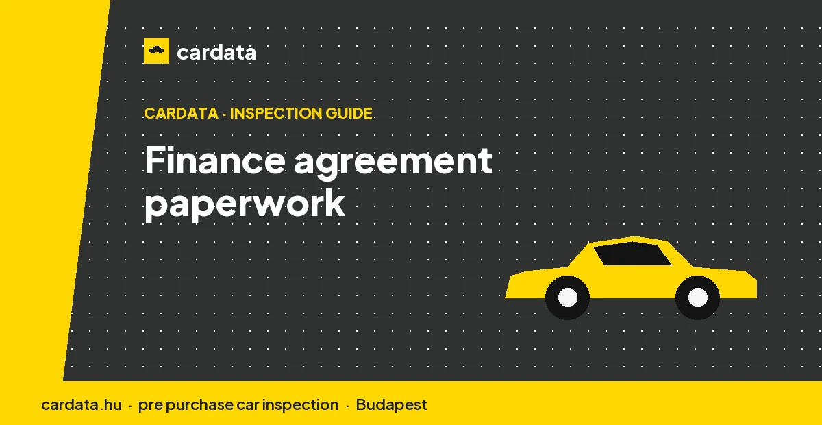 A finance agreement laid out on a desk with a calculator, representing the paperwork a buyer signs when funding a used car.